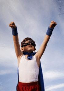 Young boy with cape, ready to fly
