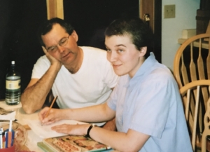 Marina Agerter sitting at a table with her dad