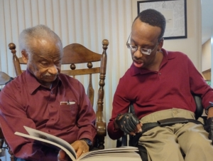 Mark Dixon reading with his father