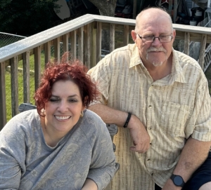 Veronica Ayala pictured sitting next to her stepdad Charlie